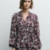 Blusa fluida com estampado floral Blusa fluida com estampado floral