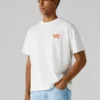 T-shirt de corte largo com estampado nas costas T-shirt de corte largo com estampado nas costas