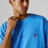 T-shirt de corte largo com estampado nas costas T-shirt de corte largo com estampado nas costas