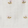 Top em malha pointelle com flores bordadas